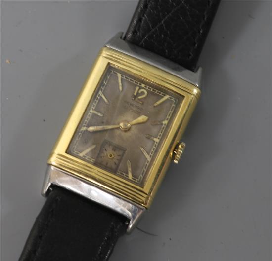 A 1930s 18ct gold and stainless steel Le Coultre Reverso manual wind wrist watch,